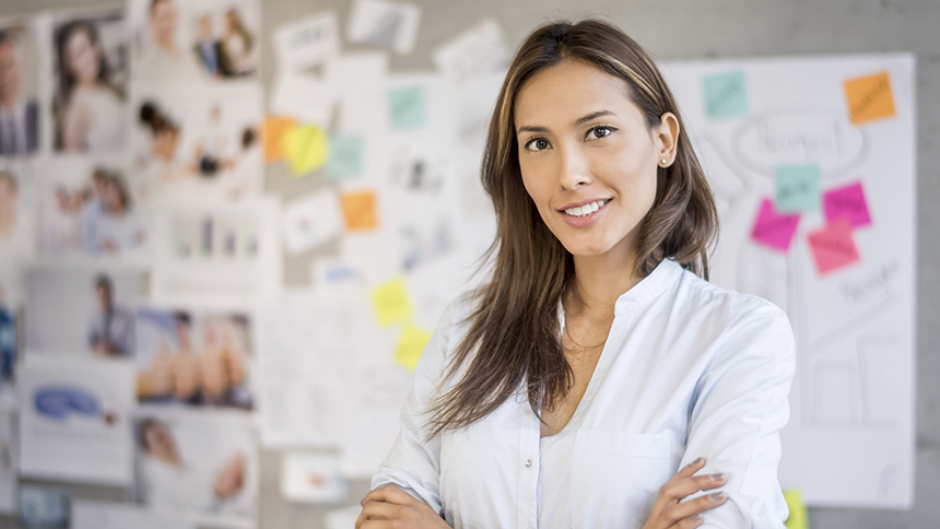 Asian business woman at the office with a wall chart at the background